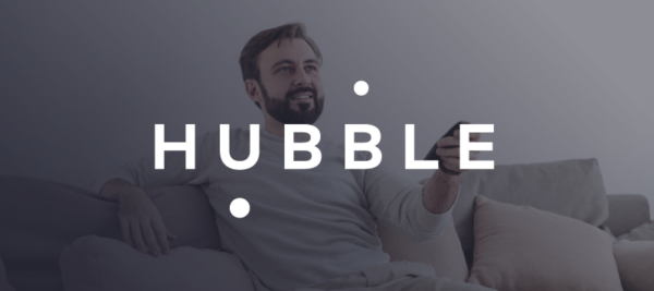 hubble logo overlaid on image of male watching tv on couch