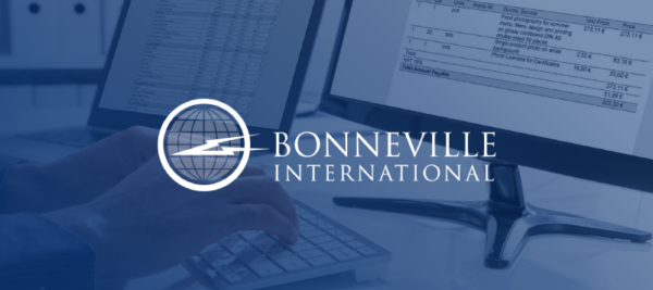 Bonneville International logo overlayed image of computer