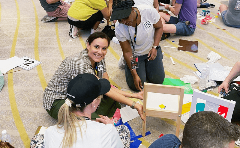An WideOrbit employee building boxes at a volunteering event