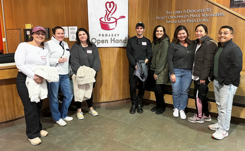 8 WideOrbit employees at a volunteer event at Open Hand