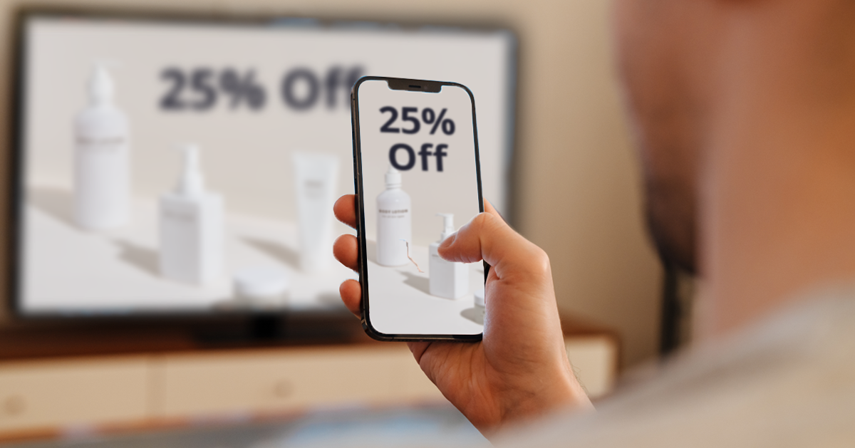 Computer screen with mirror image on phone.