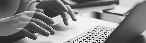 Hands typing on keyboard